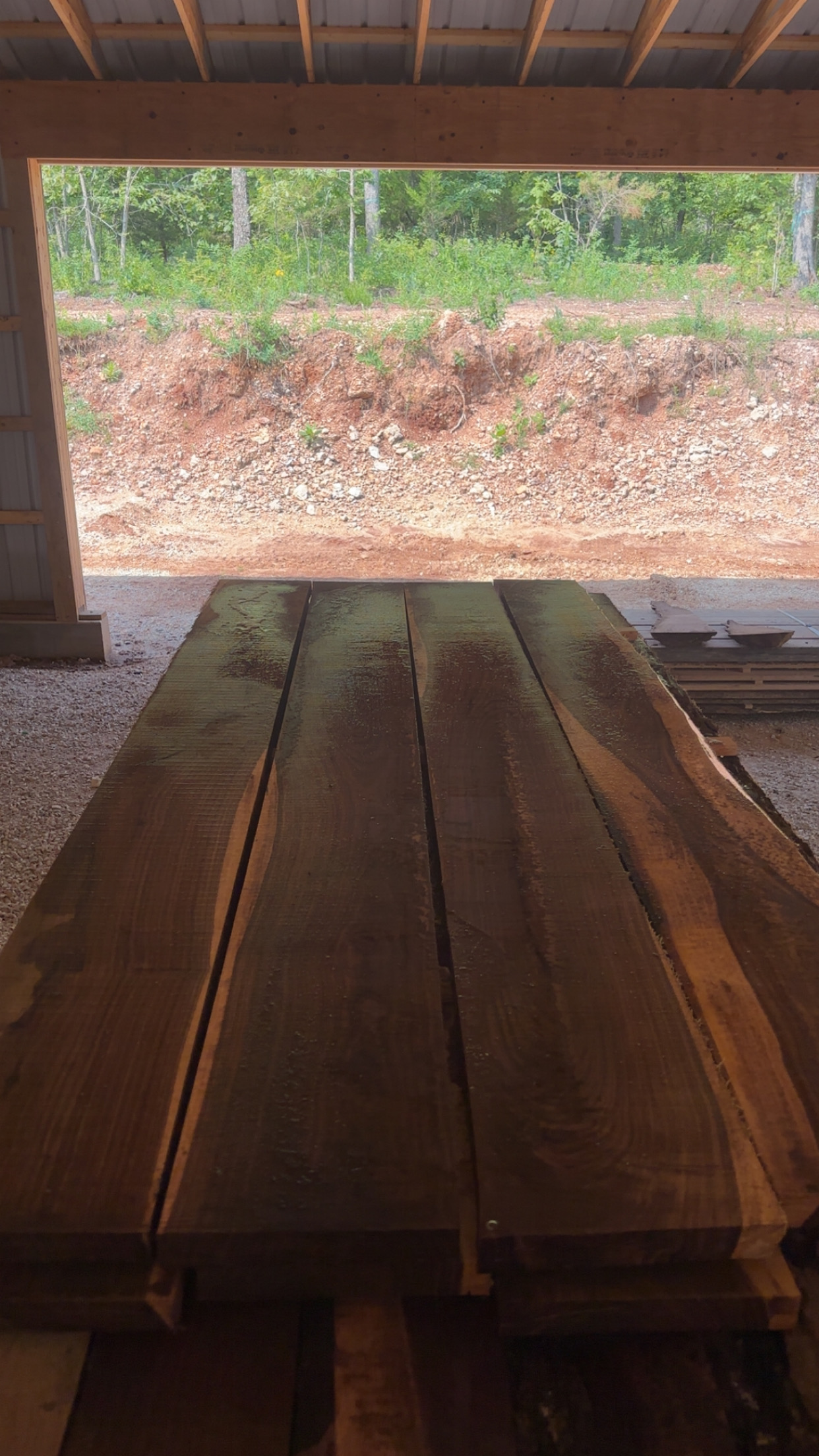 Freshly milled premium walnut boards at Rainy Creek Mill Works