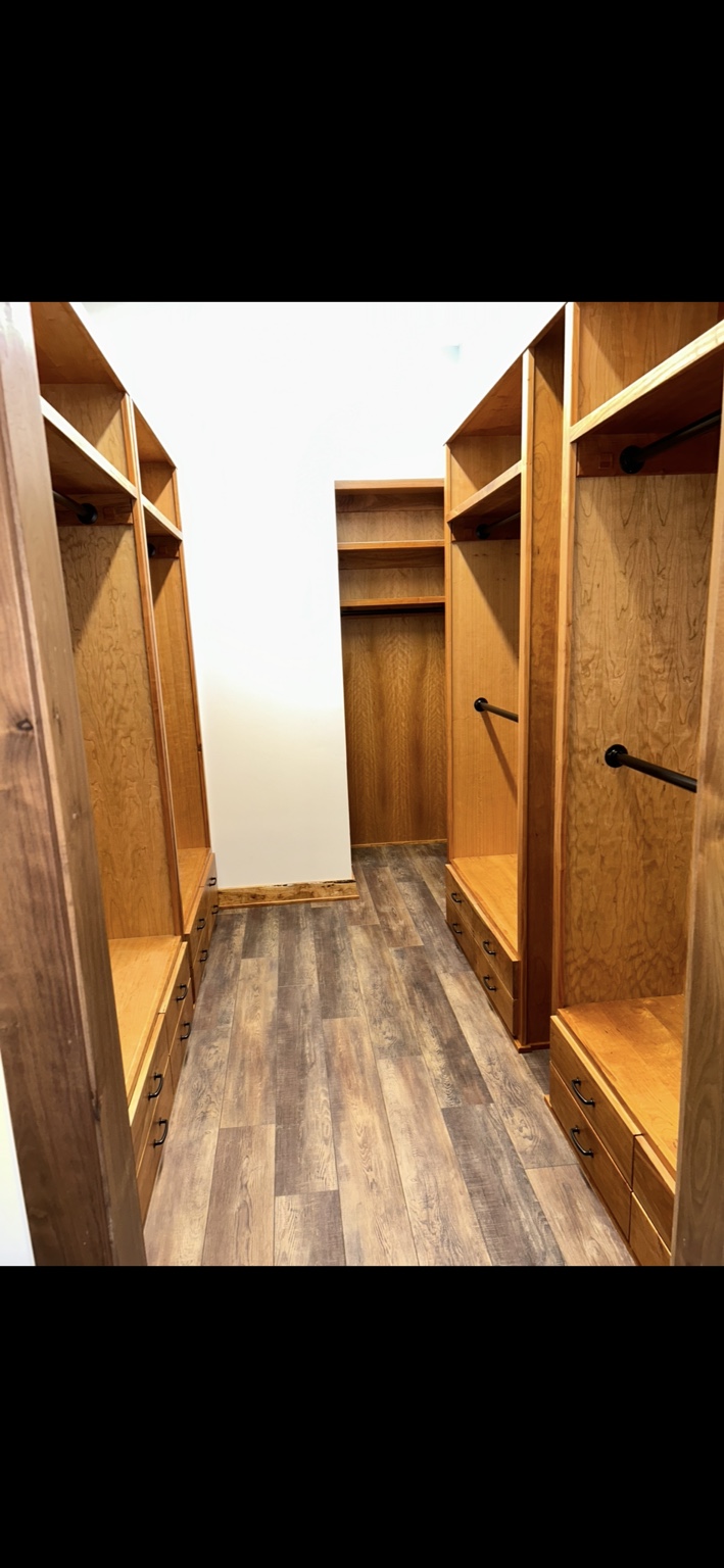 Custom hardwood walk-in closet cabinetry